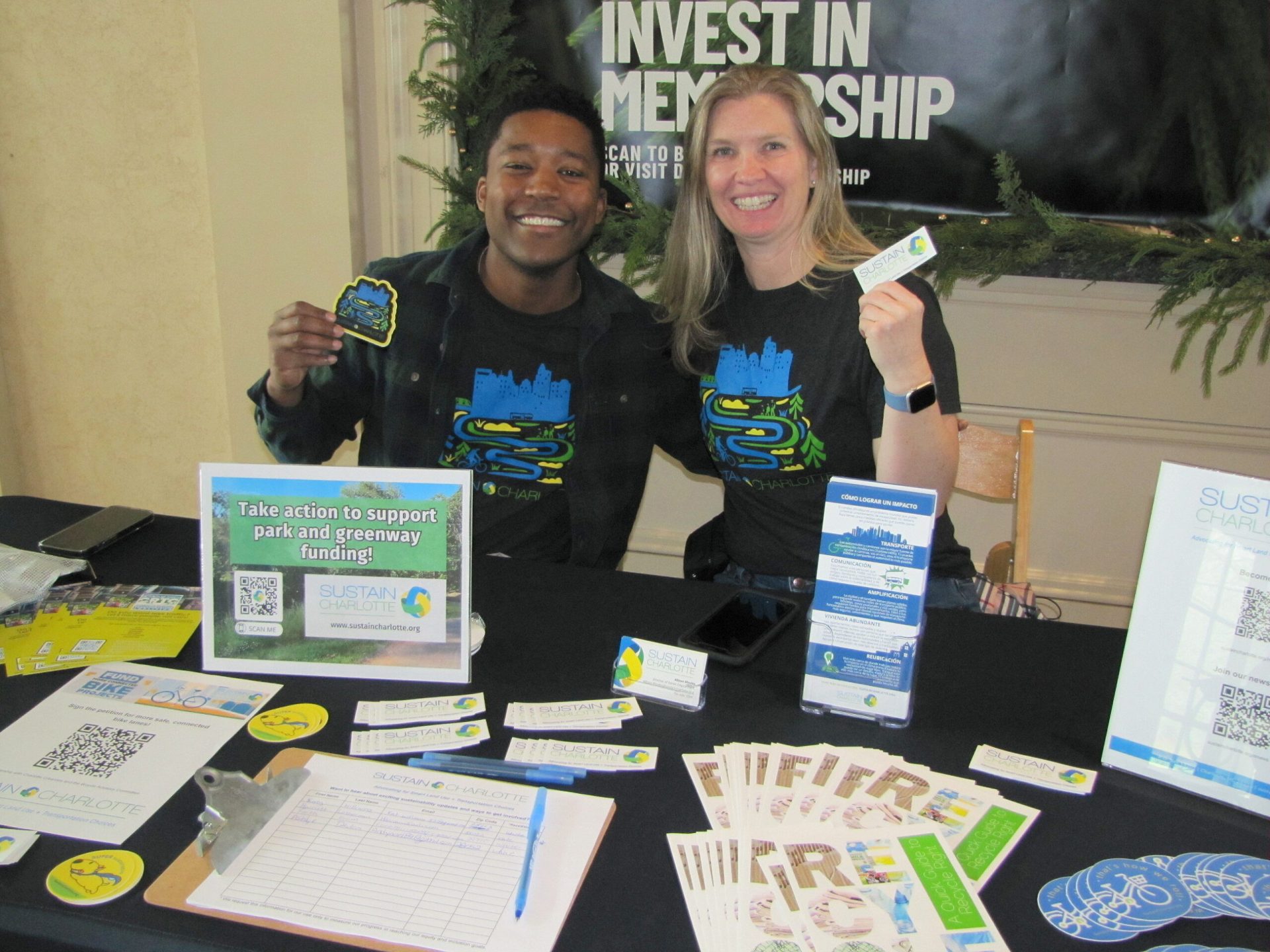 Volunteer Daniele Stowe tabling for Sustain Charlotte in 2024