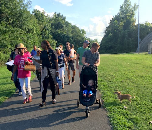 A group walking along the greenway